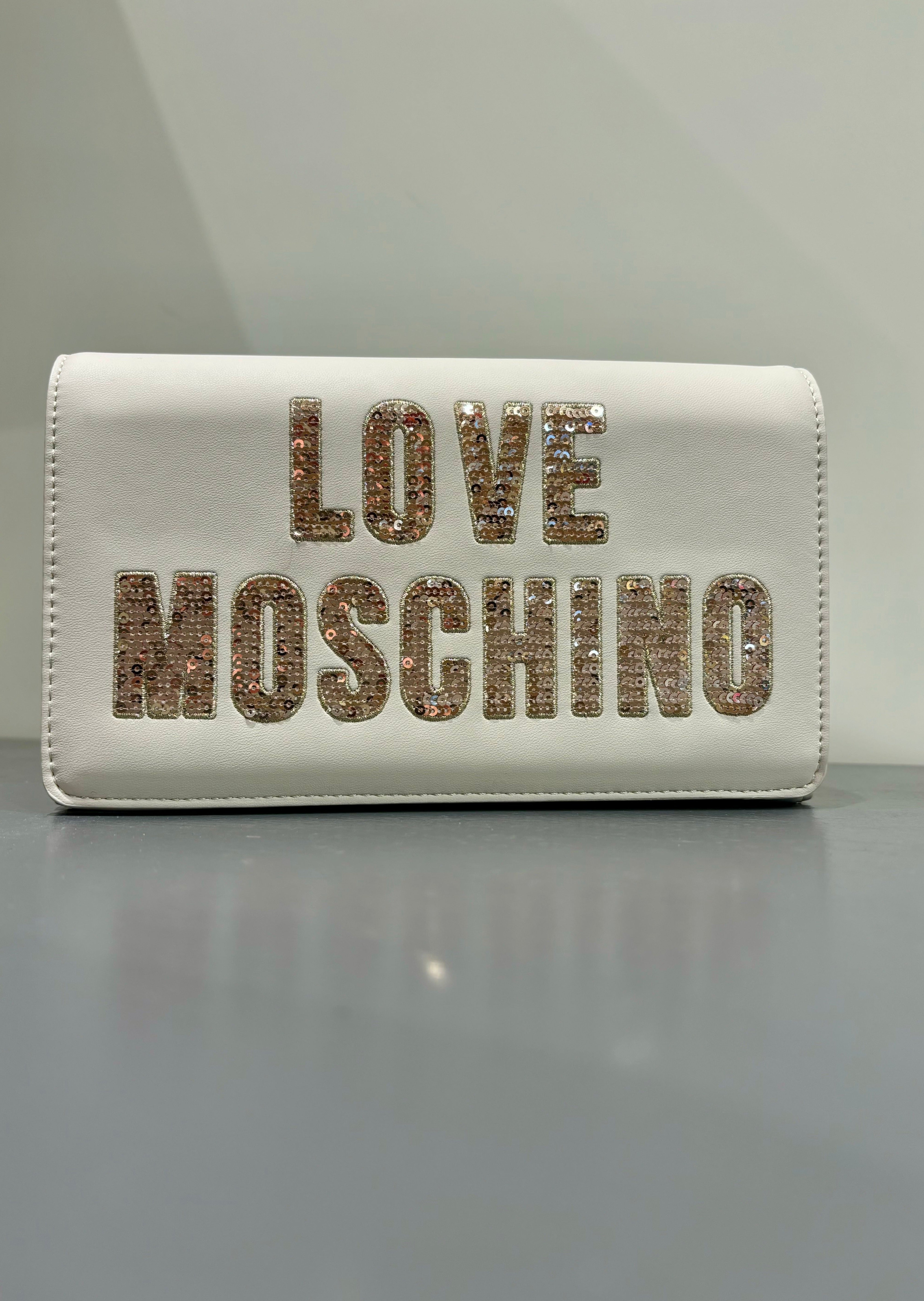 Clutch con patta e paillettes